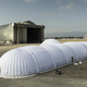 Illustration for article titled This Inflatable Aircraft Carrier Houses a Solar-Powered Wonder Plane